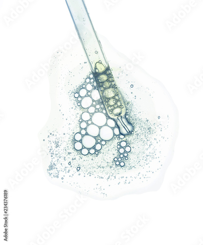 Liquid gel or serum on a screen of microscope white isolated background photo