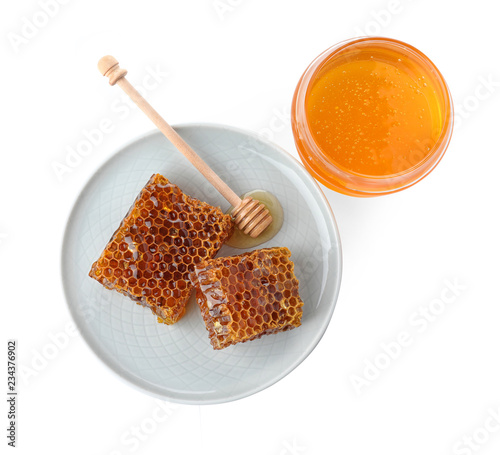 Composition with jar of honey isolated on white