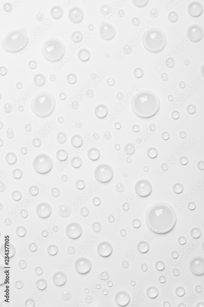 Water drops on white background, top view