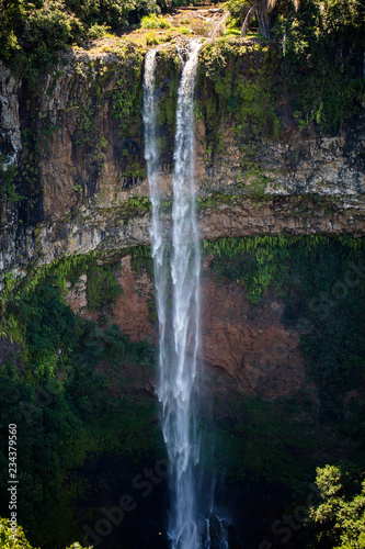 Waterfall flows into the crater of the volcano in Mauritius. National Park Chamarel.