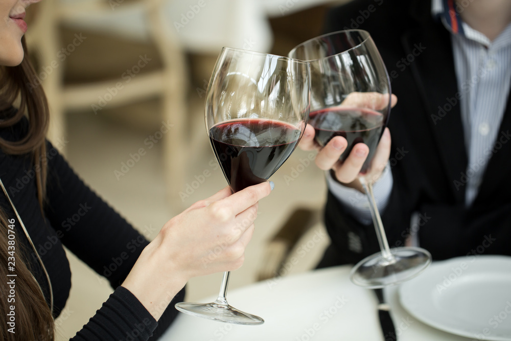 Couple toasting wineglasses Couple toasting wineglasses