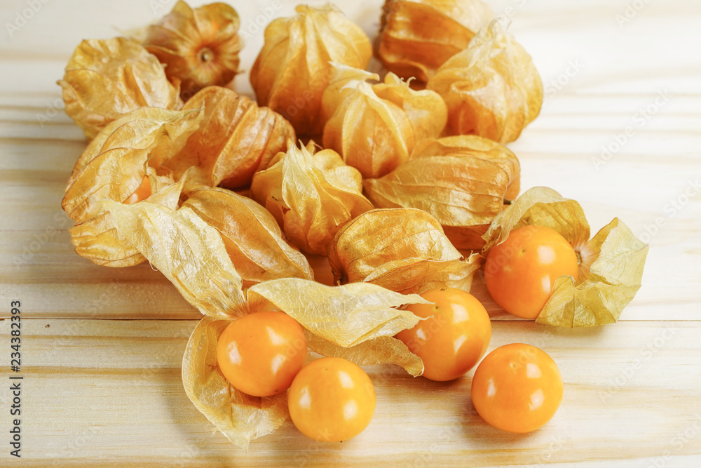 Cape gooseberry fruit on wooden background. Cape gooseberry fruit on wooden background.