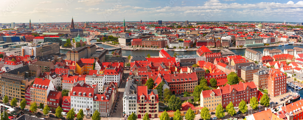 Scenic aerial panoramic view of Old Town skyline and lot of red roofs, Copenhagen, capital of Denmark