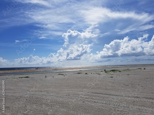sandy beach with clouds