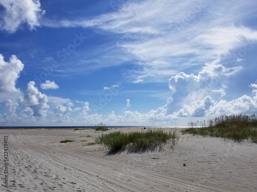 sandy beach with clouds