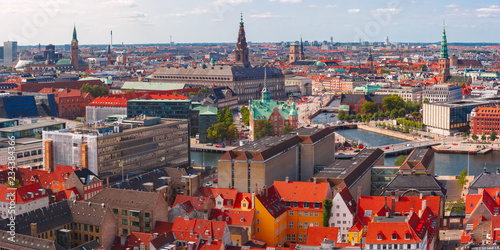Scenic summer aerial view of Old Town skyline with Boersen and Christiansborg and lot of red roofs, Copenhagen, capital of Denmark