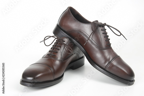 Classic men's brown Oxford shoes on white background. Leather shoes