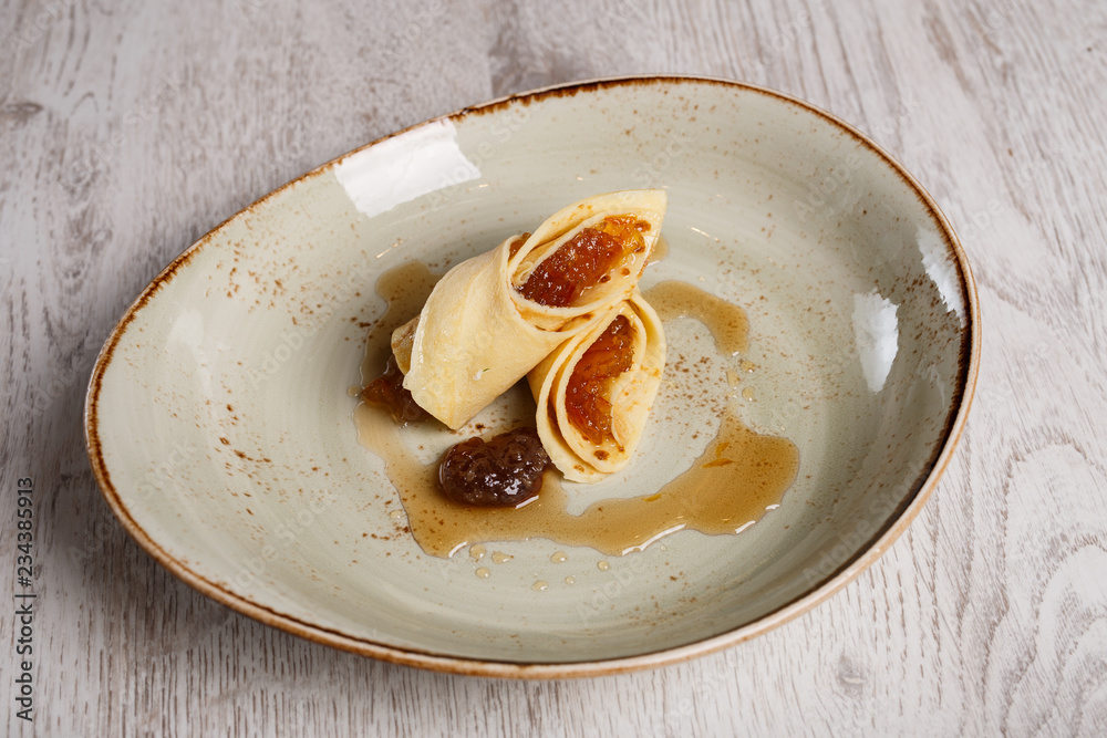European pancakes, crepes, with plum jam European pancakes, crepes, with plum jam