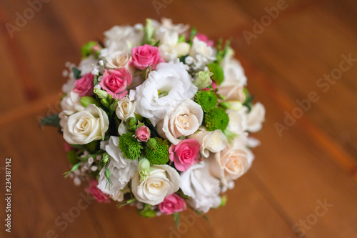 Wedding bouquet of flowers including Red hypericum, Roses, Lilies of the valley, mini Roses, Seeded Eucalyptus, Astilbe, Scabiosa, Pieris, and ivy