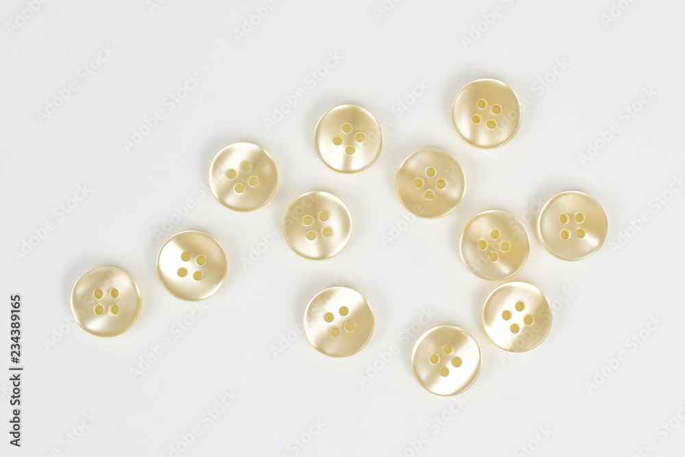 buttons scattered on a white background buttons scattered on a white background