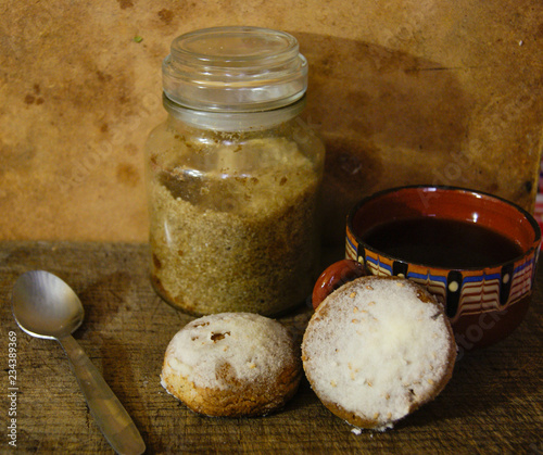 Traditional Spanish cakes with a cup of tee and sugar cane