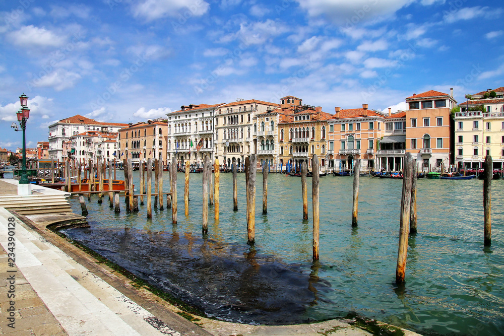 Poles for mooring gondolas along Grand Canal in Venice, Italy