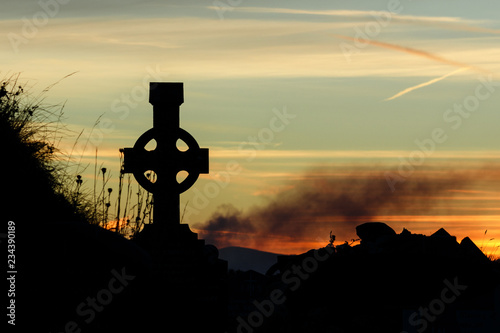 Cetic Cross at sunset on the Dingle Peninsula, County Kerry, Ireland. photo
