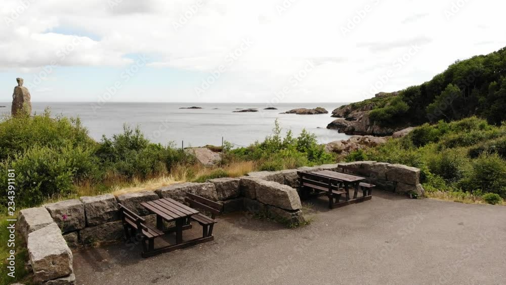 Aerial view. The North Sea coastline of south Norway, Norwegian rocky coast landscape, resting place with benches at shore. Tourist county route road 44 Aerial view. The North Sea coastline of south Norway, Norwegian rocky coast landscape, resting place with benches at shore. Tourist county route road 44