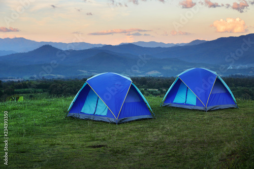 Outdoor camping tent among meadow on mountain during sunset at Yun Lai Viewpoint, Pai town , Mae Hong Son in Thailand. This is very popular for photographers and tourists.Travel and natural Concept