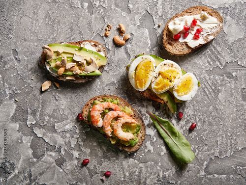 Overhead view of avocado toasts. Plant-based food