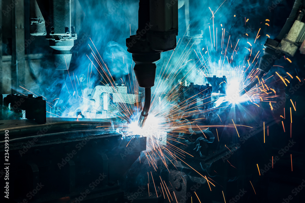 Team industrial robot are welding in factory Team industrial robot are welding in factory