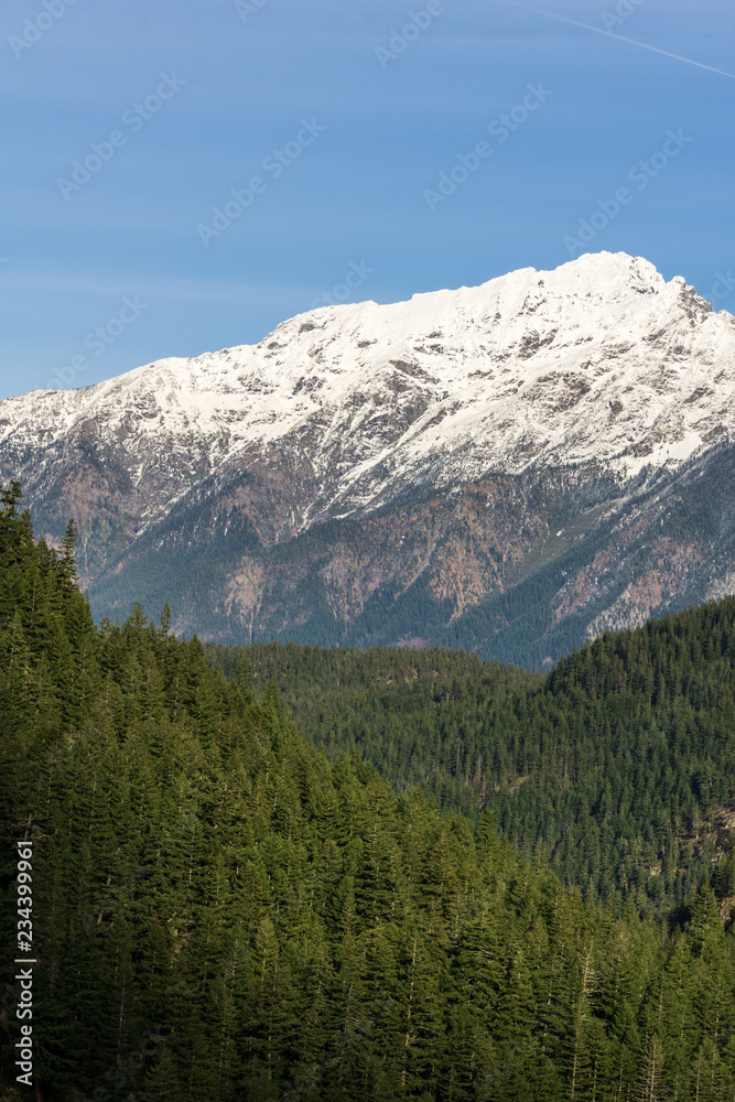 Mountain peak in snow with clear sky north of USA.