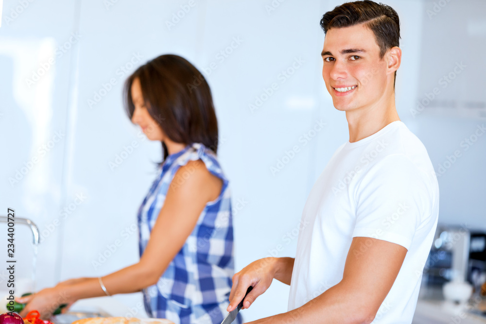 Couple cooking together at home Couple cooking together at home