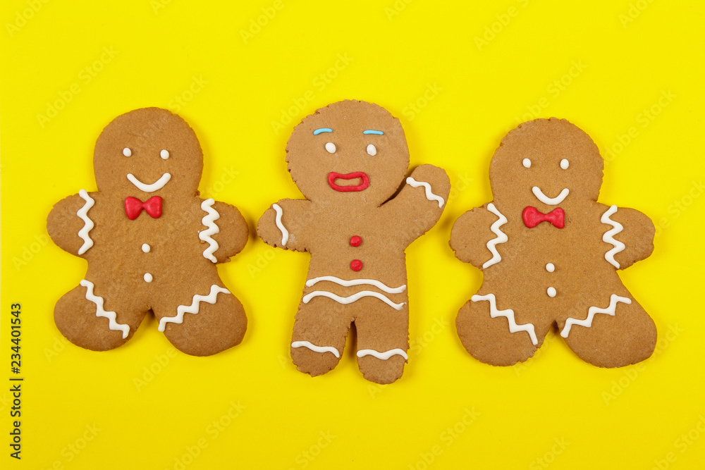 Christmas cookies, gingerbread In the form of a man on yellow background. Christmas background Christmas cookies, gingerbread In the form of a man on yellow background. Christmas background