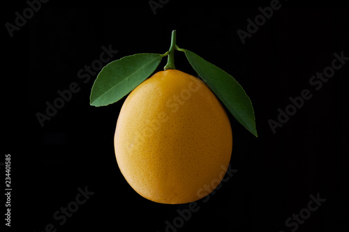 lemon fruit with leaf isolated on black background