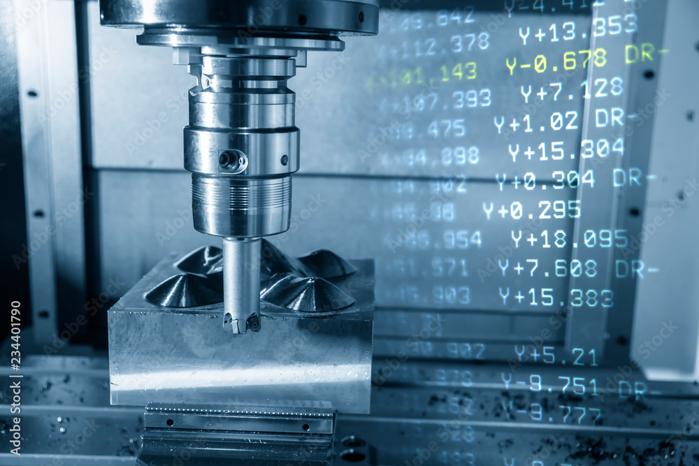 The  abstract scene of CNC milling machine and NC data.The CNC milling machine cutting the mold part with the index-able radius end mill tool in roughing process.