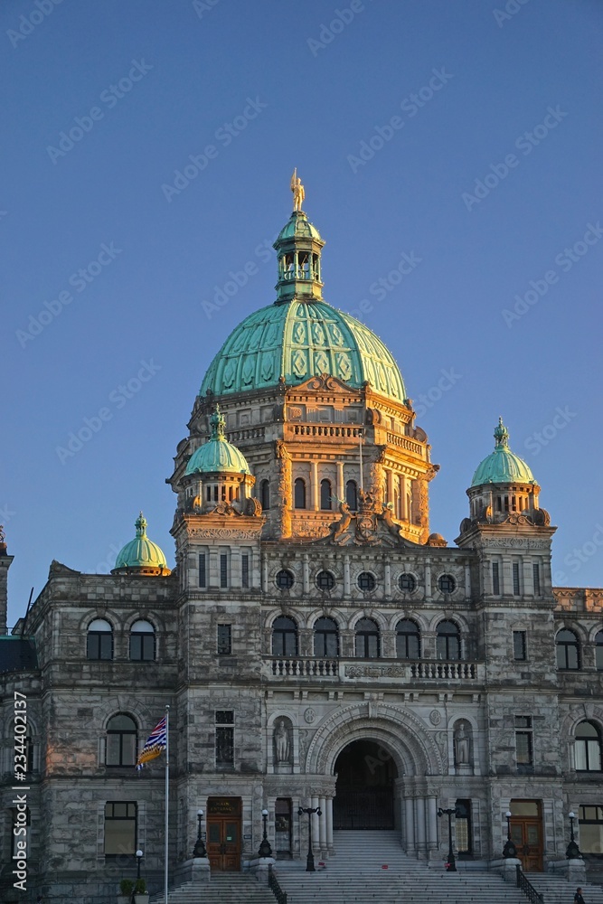 Victoria, British Columbia, Canada: The Neo-Baroque architecture of the British Columbia Parliament Buildings (1897), at sunset.