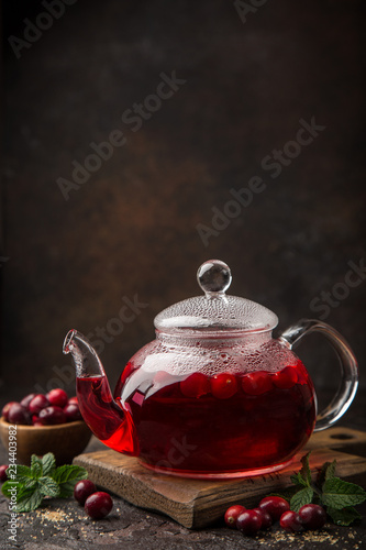 hot cranberry drink in glass tea pot