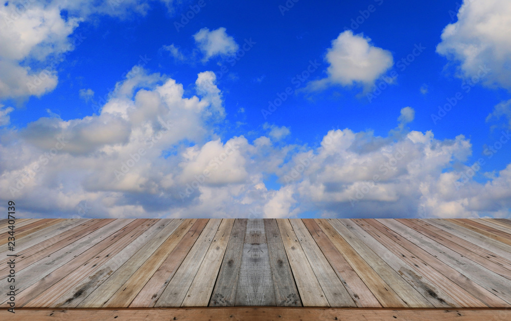 Empty top wooden table on sky background