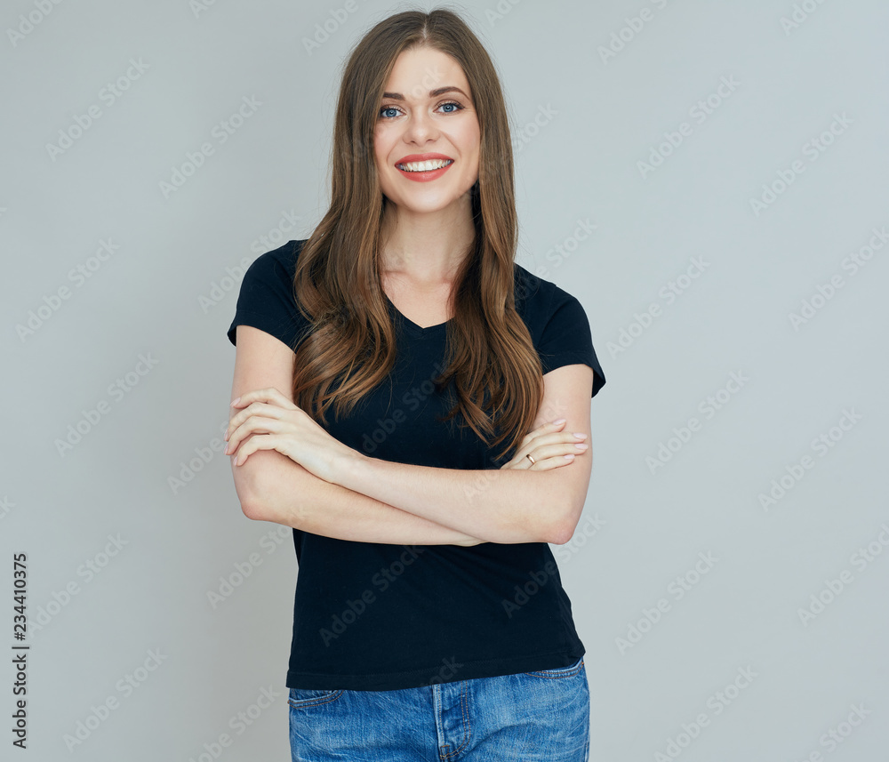 woman wearing black t shirt standing with crossed arms. woman wearing black t shirt standing with crossed arms.