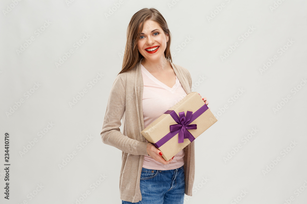 Beautiful woman with long hair standing with gift box. Beautiful woman with long hair standing with gift box.