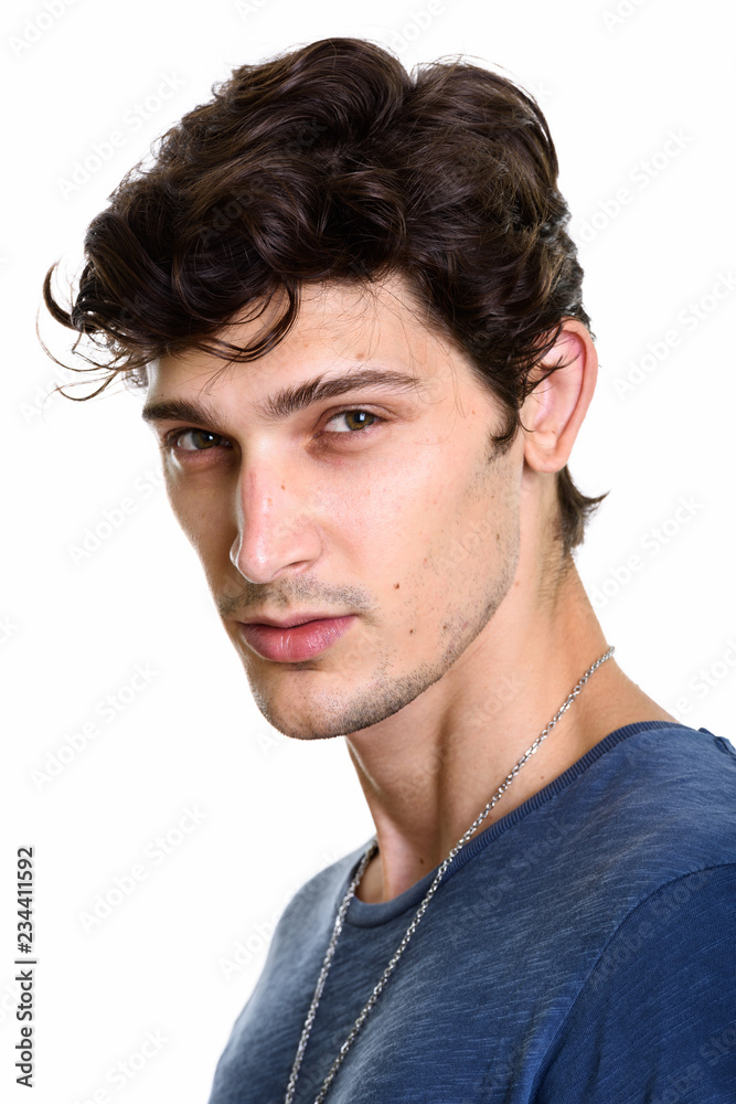 Face of young handsome Brazilian man looking at camera Face of young handsome Brazilian man looking at camera