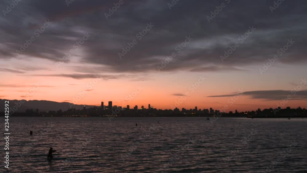 Vancouver Sunrise Paddle 4K UHD. A paddleboarder at sunrise on English Bay, Vancouver. 4K. UHD. Vancouver Sunrise Paddle 4K UHD. A paddleboarder at sunrise on English Bay, Vancouver. 4K. UHD.