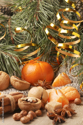 Still life formed with pine branches and New Year sweets