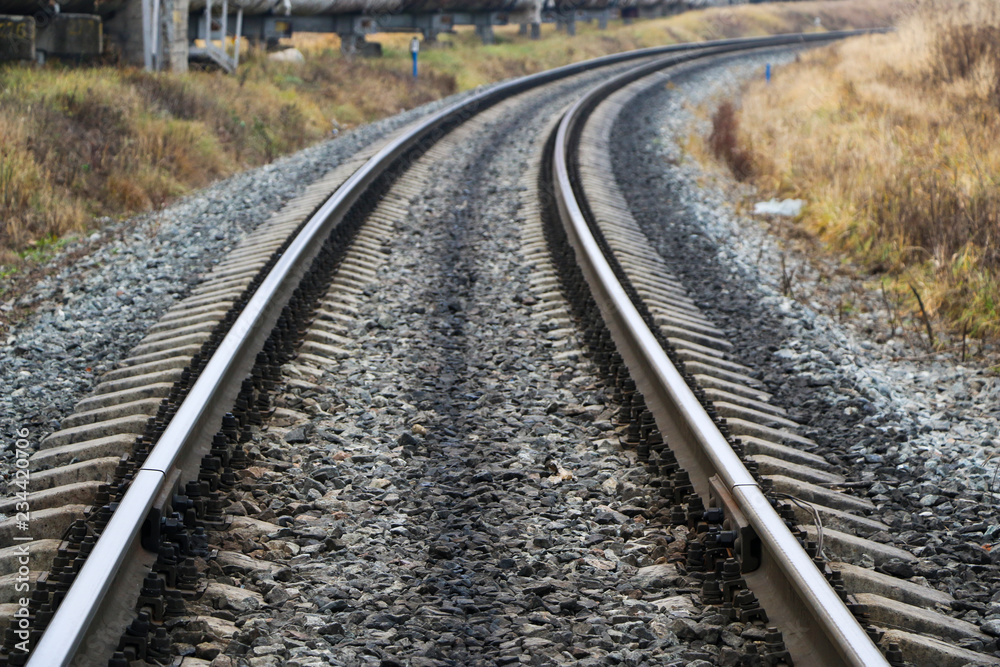 railway in the industrial zone..empty rails with a semaphore, in anticipation of a freight train. railway in the industrial zone..empty rails with a semaphore, in anticipation of a freight train.