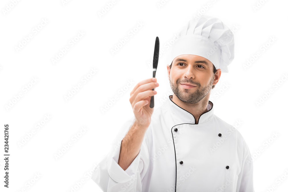 smiling young chef holding knife isolated on white smiling young chef holding knife isolated on white