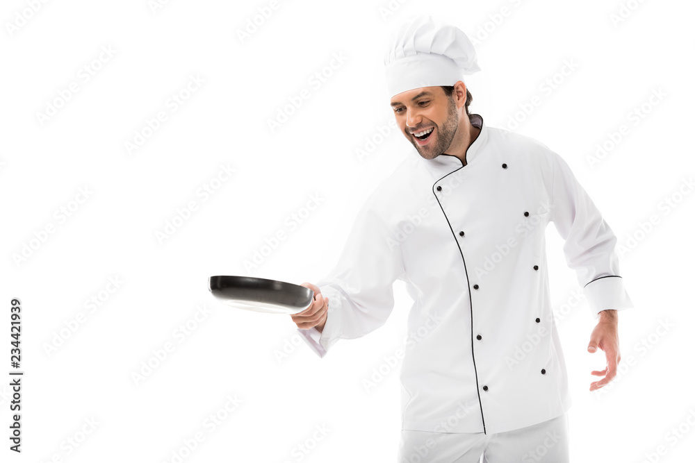 happy young chef cooking with frying pan isolated on white happy young chef cooking with frying pan isolated on white