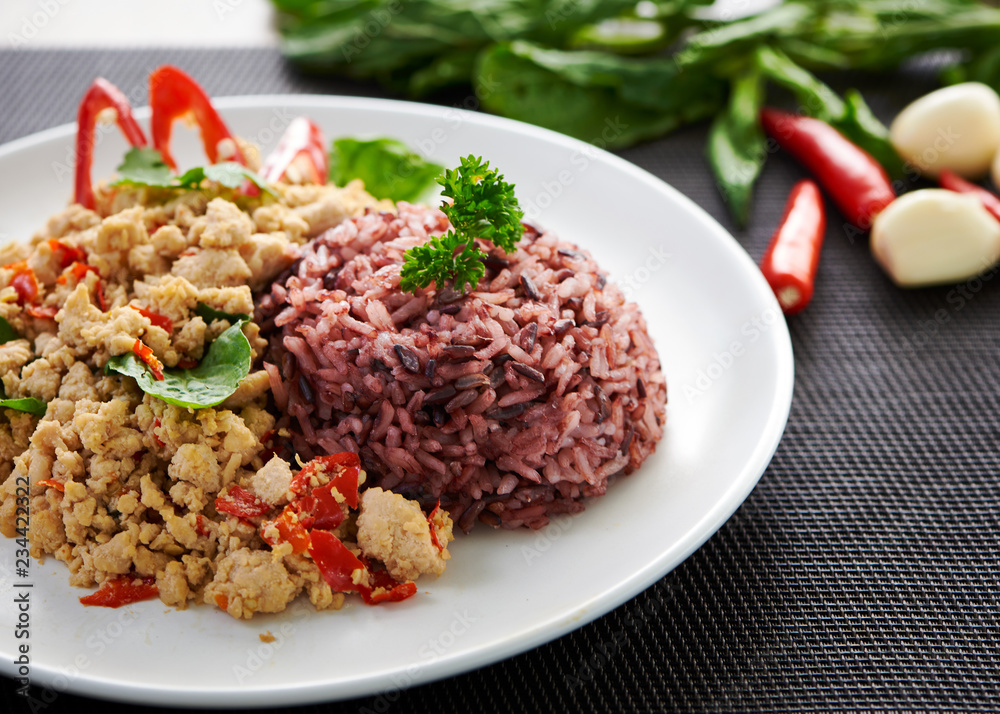 Fried rice with chicken basil on the table Fried rice with chicken basil on the table