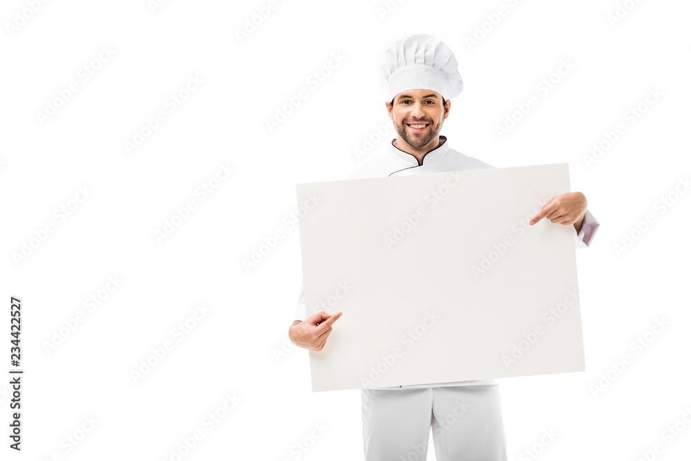 professional chef pointing with finger at blank banner and smiling at camera isolated on white professional chef pointing with finger at blank banner and smiling at camera isolated on white