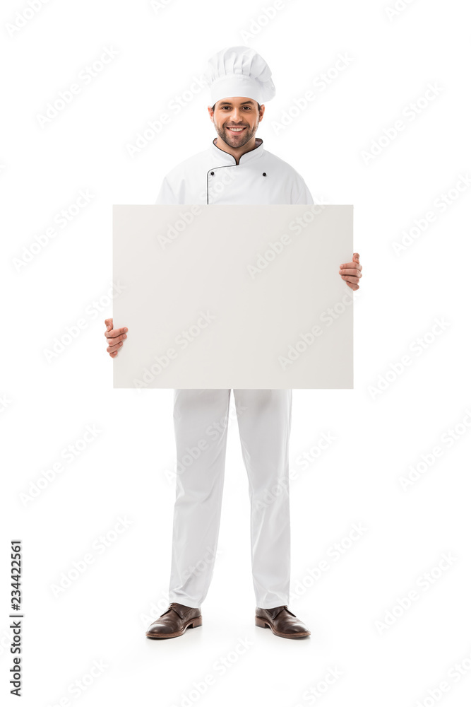 full length view of handsome male cook holding blank placard and smiling at camera isolated on white full length view of handsome male cook holding blank placard and smiling at camera isolated on white