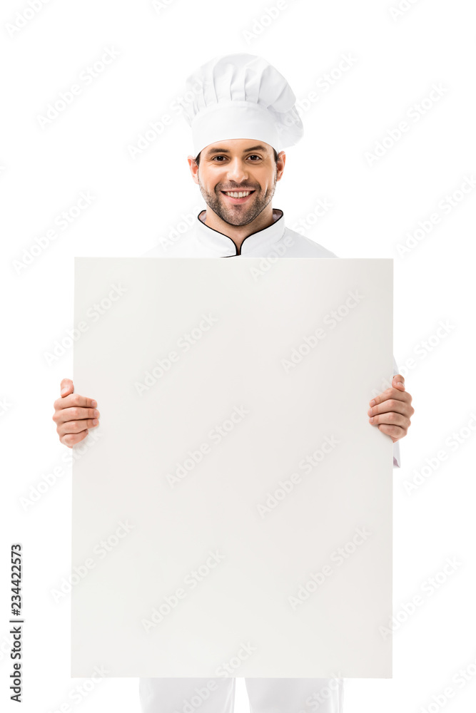 professional young chef holding blank placard and smiling at camera isolated on white professional young chef holding blank placard and smiling at camera isolated on white