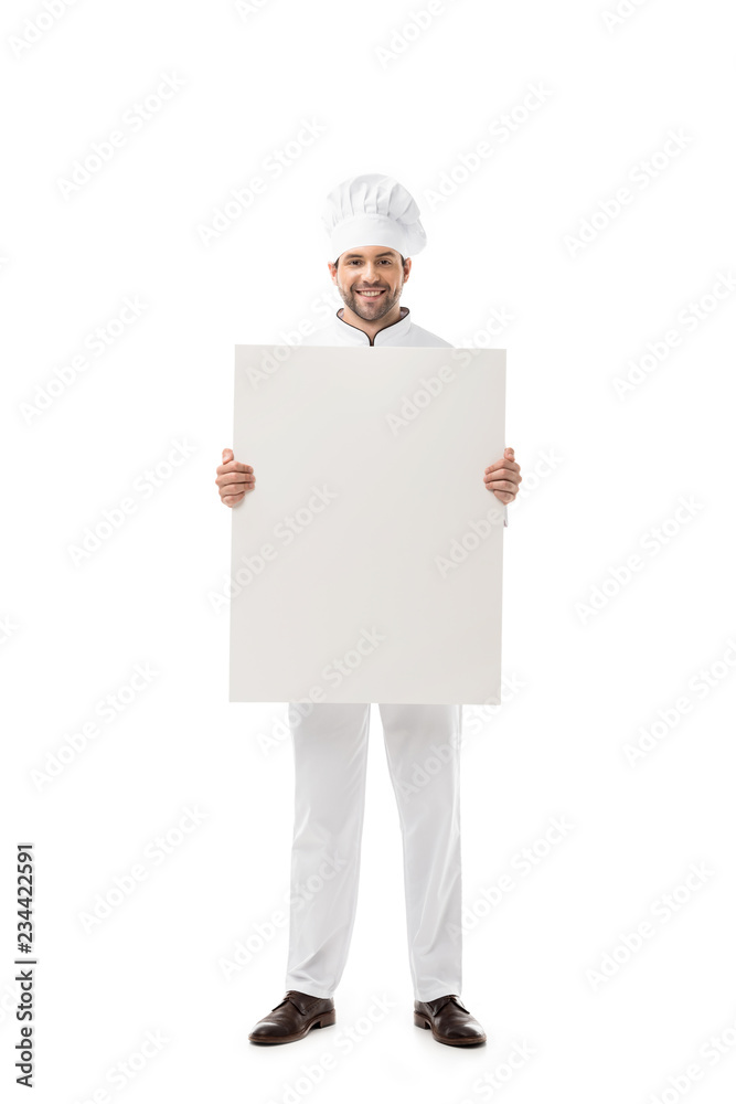 handsome young chef holding blank banner and smiling at camera isolated on white handsome young chef holding blank banner and smiling at camera isolated on white