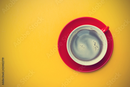Coffe cup on yellow