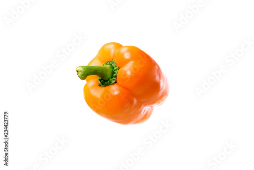close-up view of fresh raw orange bell pepper isolated on white