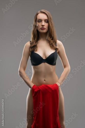 Young woman wearing only a bra cropped shot