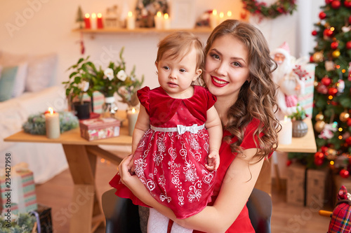 Christmas family Mom and daughter. Merry Christmas and Happy Holidays card! Morning before Xmas background. Portrait loving family. Family preparation holiday food. Happy New Year! Christmas baby © Aleksandr