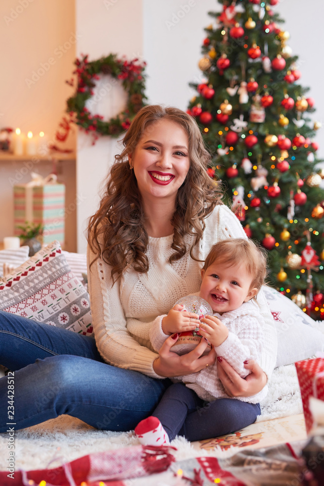Christmas family Mom and daughter. Merry Christmas and Happy Holidays card! Morning before Xmas background. Portrait loving family. Family preparation holiday food. Happy New Year! Christmas baby