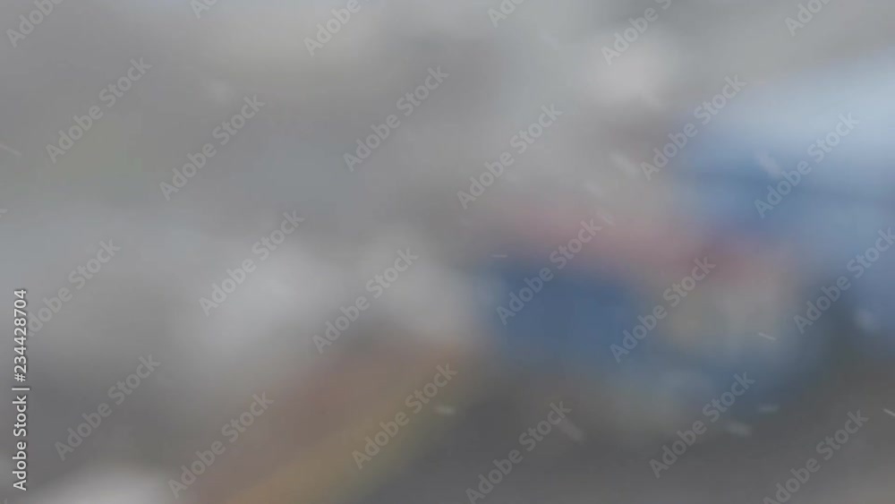 Out of focus - snow over the city. Blurred background. Out of focus - snow over the city. Blurred background.