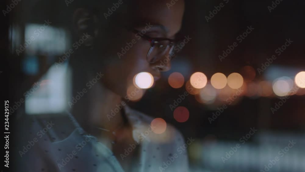 close up beautiful business woman working late using tablet computer browsing research data statistics on screen brainstorming successful project deadline strategy looking out window planning ahead