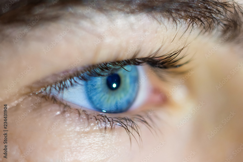 Blue man's eye close-up. Caring for vision, vision check in the clinic+